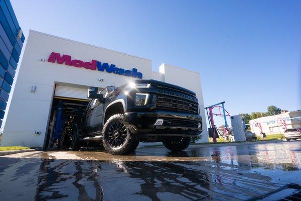 Truck exiting ModWash car wash tunnel