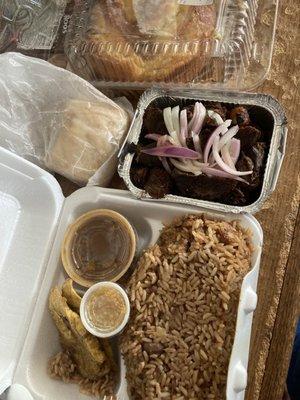 Tasot, rice n beans, fried plantains, gravy, picklez and beef patties.