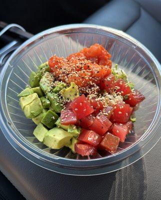 Marinated Tuna, Spicy Salmon, Avocado, and Sushi Rice with Ponzu Sauce, Green Onions, and Sesame Seeds. So amazing!