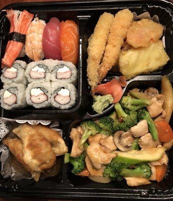 Chicken bento. $16.95 includes hib chicken/veg, pork dumplings, Ca. roll (subbed Philly), 4 pieces of sushi, veg tempura and soup & salad.