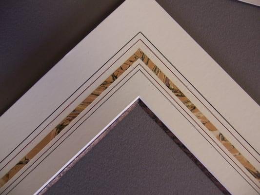 Close up of a French Mat with a marbleized paper panel and a marbleized paper accent bevel