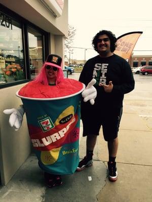 Customer posing with Slurpee girl