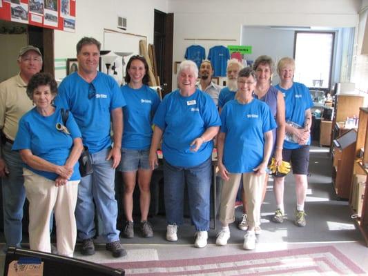 Some of our fabulous volunteers, ready to help you find what you need at the Surplus Sale!