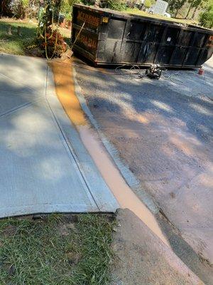 Poured concrete down our drain + bad grading