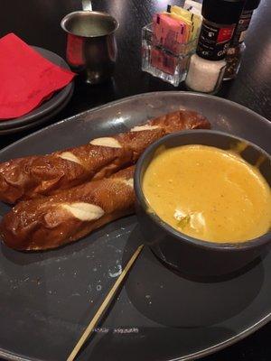 Warm pretzel sticks with beer cheese dip careful it's definitely a bit spicy!