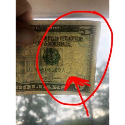 Example of what I showed her. When you can see that 5 in the back like that, that's one way to tell the bill isn't fake.