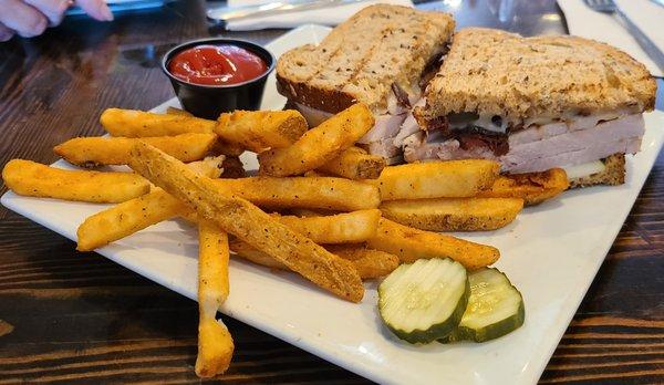 Dublin Gobbler - roasted turkey breast, cheddar, apple slices, cranberry mayo, on grilled multigrain bread.