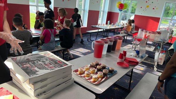 Birthday party package includes pizzas, drinks,  cupcakes, goodie bags, and arcade gaming cards