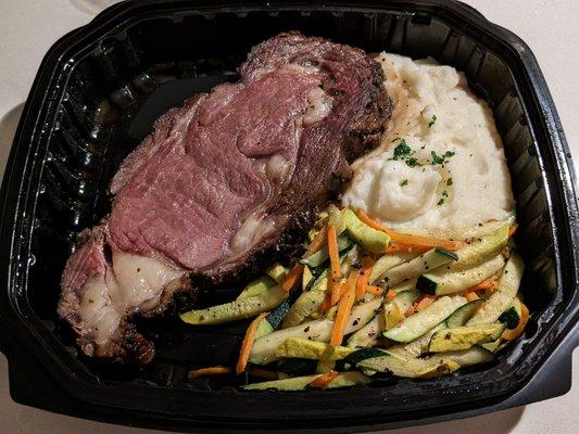 Prime Rib with Mashed Potatoes and Seasoned Vegetables. Sides were okay, but the Prime Rib was good! I recommend!