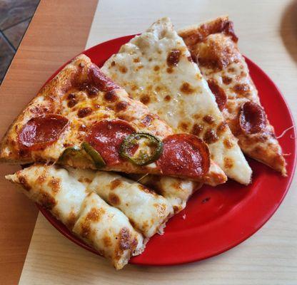 Variety of assorted hot and fresh pizza