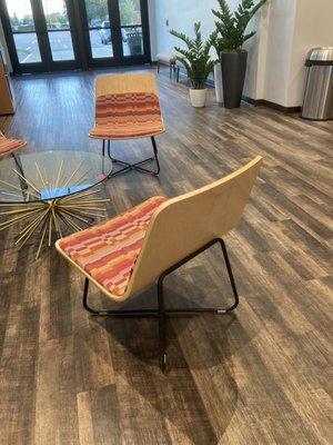 Elegant chairs and glass coffee table.