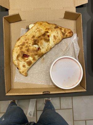 Calzone with ricotta, mozzarella, pepperoni and marinara