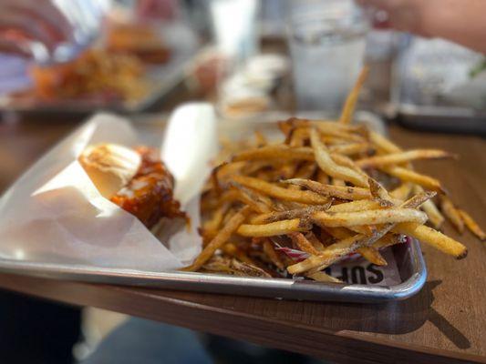 Seasoned fries, and buffalo sauced chicken sando