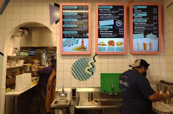 View of the menu boards and kitchen preparation area