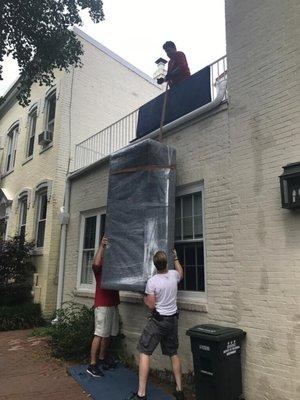 Couch didn't fit through the front door; so we hoisted up to second floor to go in through the back door.