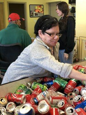 Diane sorting cans to send to the distributor