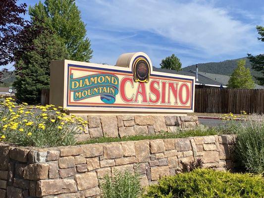 Diamond Mountain Casino signage on west side of the building in front of the Tesla Superchargers