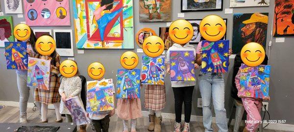 Kids with their finished artwork