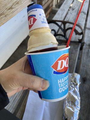 Dipped chocolate cone in a cup.