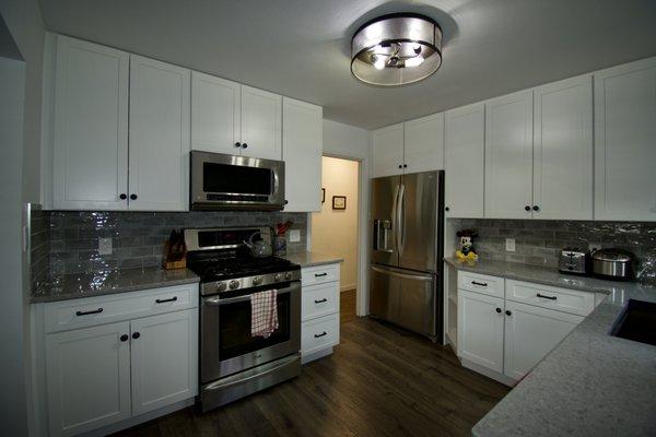 A newly completed kitchen remodel in San Mateo. White cabinetry but without a crown molding gives a very contemporary look.