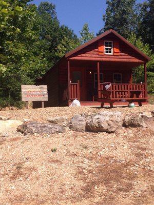 Cabin with queen bed, bunk beds and a bed in the loft. Full kitchen and bathroom.