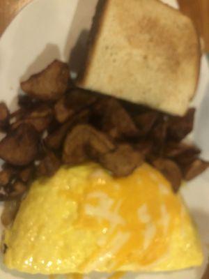 Vegetable omelette and fried potatoes.