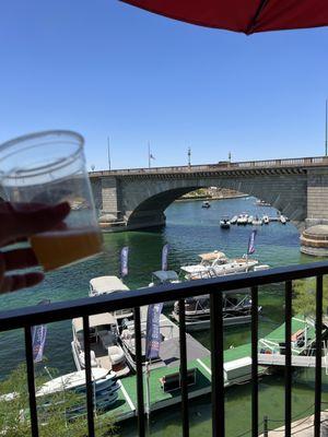 View of London Bridge from patio deck outside pizza joint.