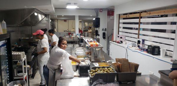 Hard working staff making some amazing food. Thank you.