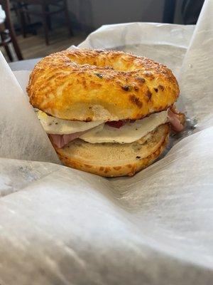 Jalapeños Cheddar bagel with egg,bacon and ham