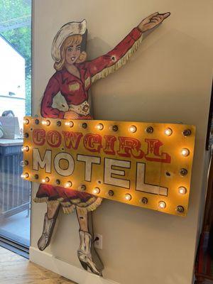 Cowgirl Motel lit sign inside the Kendra Scott Flagship