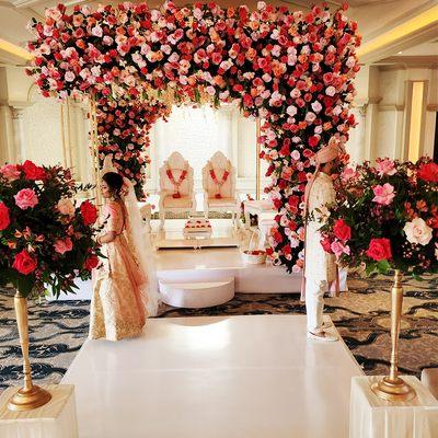 Surrounded by the ethereal beauty of our floral wedding mandap, the bride and groom stand back-to-back

https://dipali.com/contact-us/