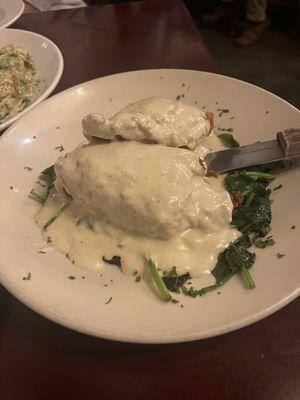 Risotto stuffed chicken with sautéed spinach and a lemon cream sauce.