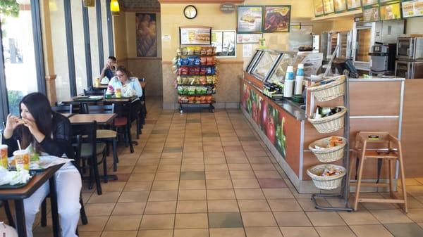 Restaurant interior, with guests enjoying their meals.