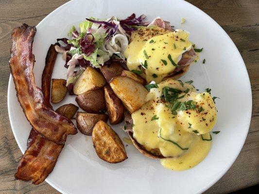 Eggs Benedict with a side of bacon