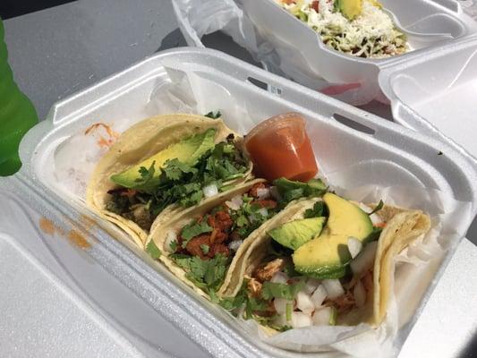 Tres tacos and hot sauce. Al pastor, barbacoa, and steak