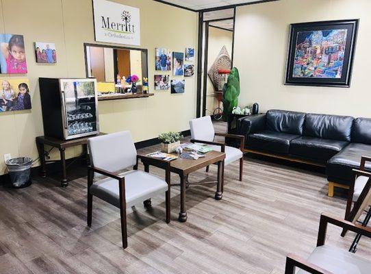 Waiting room for patients equipped with complementary coffee and personal water bottles