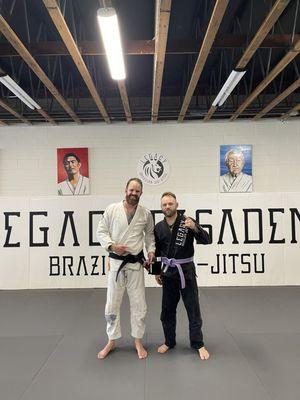 Me getting my second stripe on my purple belt.