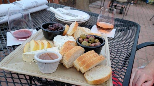 Hit up the wine bar for a glass and a cheese platter to enjoy on the patio.