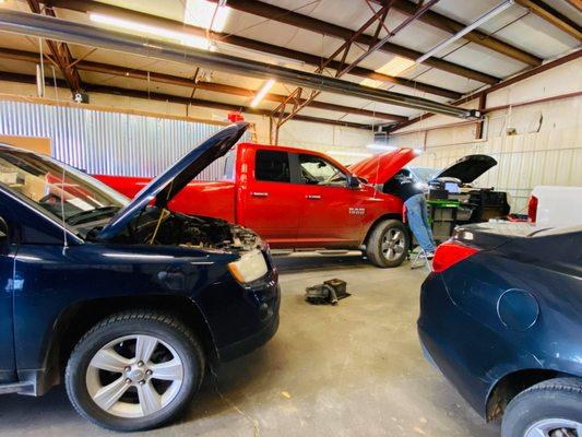 Industrial trucks under repair at Atelier Automotive