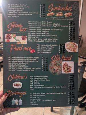 Front of menu with appetizers, drinks, and sandwiches