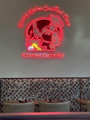 Neon art over a banquette