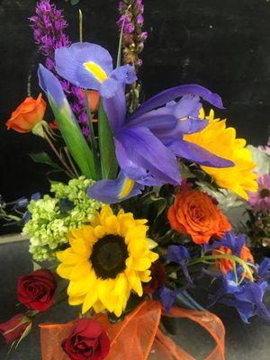 Sunflowers, Purple Iris, Orange Roses, & Green Hydrangea.