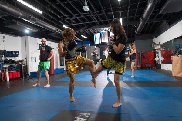 Working leg kicks in our Muay Thai Kickboxing class.