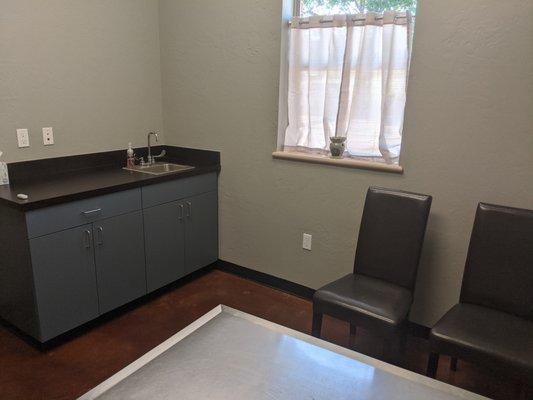 Exam rooms with a separate hallway exam room prepared for clients who are saying goodbye to their beloved pets.