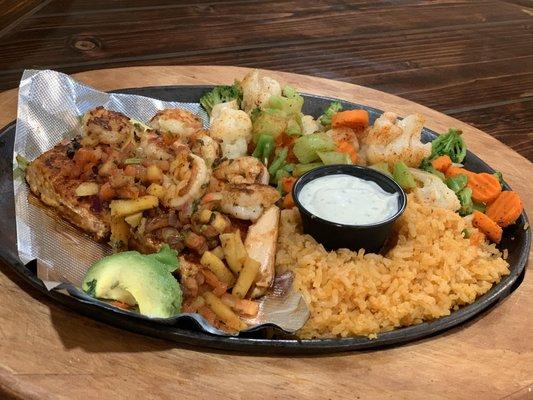 Santa Fe Salmón- Grilled Salmón Topped with Grilled Shrimp & Pico De Mango. Served with Rice, Steamed Veggies & a Side Of Cilantro Ranch.