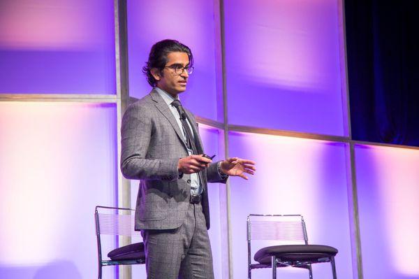 Dr. Gaurav Bharti lecturing in Nashville on innovate plastic surgery techniques.