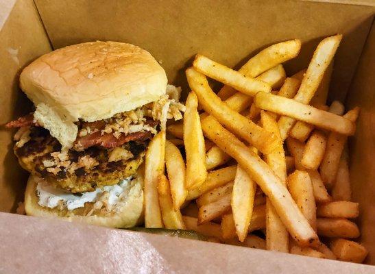 "Texan Crab Cake Sandwich" (w/ jalapeño cream cheese, bacon, and onion crisps) and Old Bay seasoned fries.