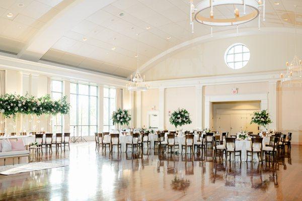 Estate table flowers and candles and reception table centerpieces by UFE. Photo by Leigh Wolfe Photography. Venue: Atlanta History Center.