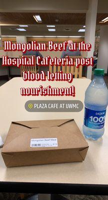 Clean sanitized tables spaced well apart, water in 100% recycled plastic bottles and a box of Mongolian BBQ beef, rice and lots of broccoli.