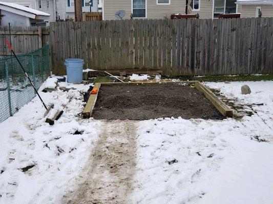 Crushed stone shed pad install - raised the area up with stone, outlined in 6x6 pressure treated timbers to keep new shed high and dry.